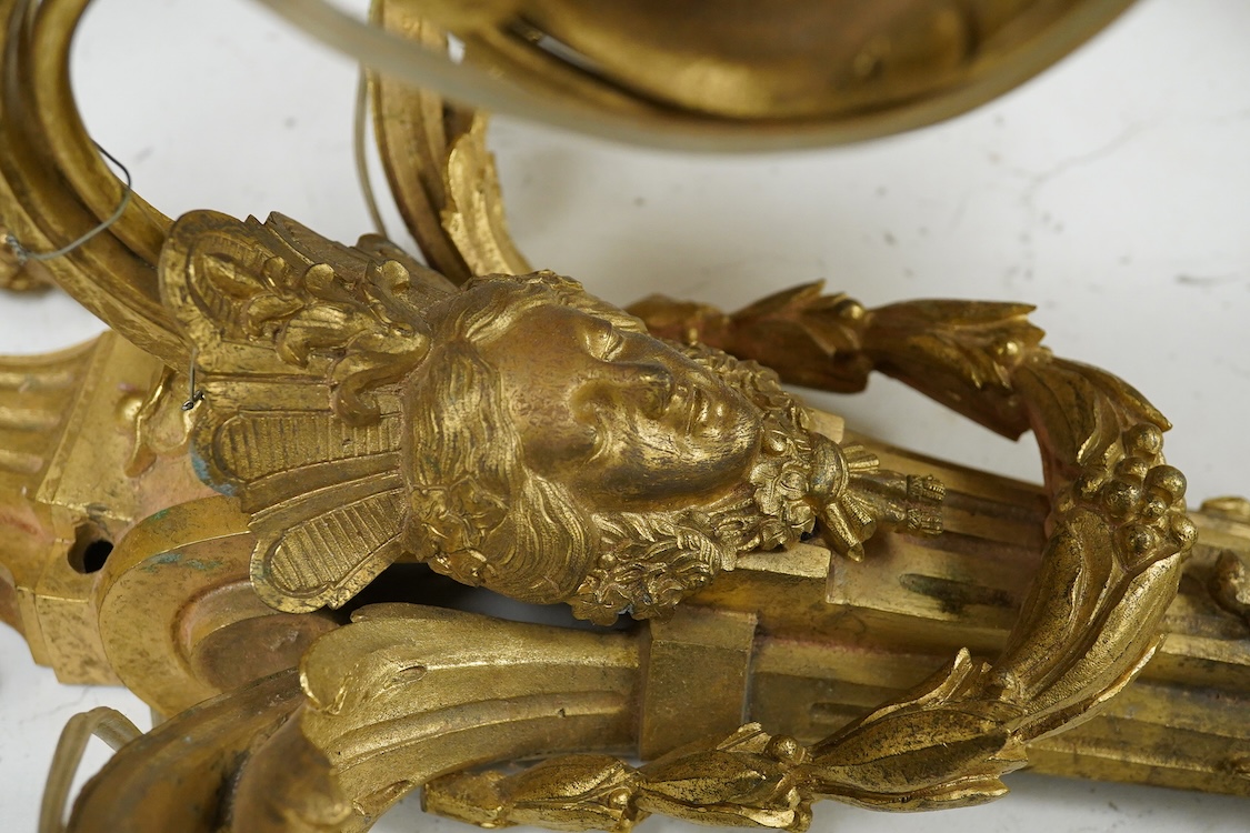 A pair of Adam style cast brass three branch wall sconces - 36cm high, with similar two branch sconce